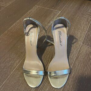 Breckelle’s metallic gold ankle strap heels